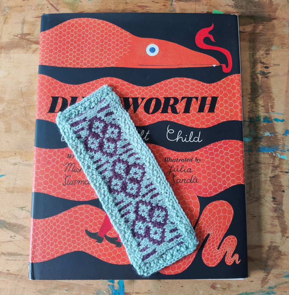 fair isle knitted bookmark on a book